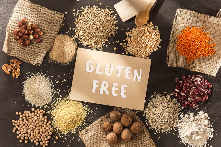 Gluten free flour and cereals millet, quinoa, corn bread, brown buckwheat, rice with text gluten free