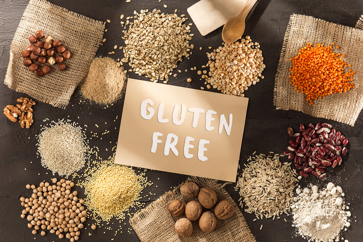 Gluten free flour and cereals millet, quinoa, corn bread, brown buckwheat, rice with text gluten free